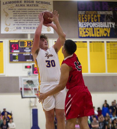 Lemoore's Samuel Martinez takes a shot against Hanford in the Tigers' loss Thursday night in the Lemoore Event Center.